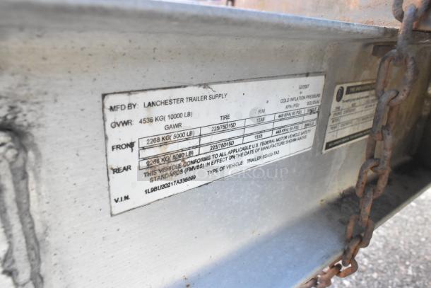 Label on 2007 Lanchester food trailer showing specs: GVWR 4536 kg, GAWR 2268 kg, 15x6 tires, confirming compliance with FMVSS.