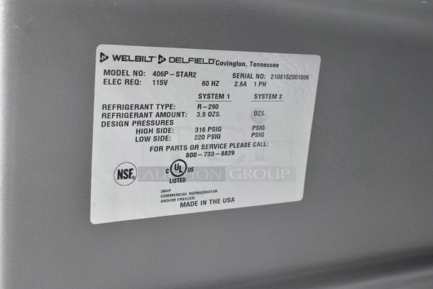 2021 Delfield 406P-STAR2 stainless steel undercounter cooler, commercial casters, 115V, model label visible.