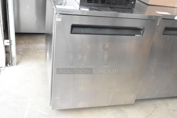 2021 Delfield 406P-STAR2 stainless steel undercounter cooler, single door, on casters. Features Delfield logo and QR code.