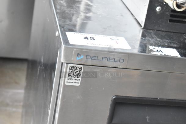 2021 Delfield 406P-STAR2 stainless steel undercounter cooler, single door, commercial casters, visible QR code for service.