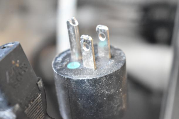 Close-up of a 3-prong electrical plug for the 2021 Automatic Bar Controls JT-NITCOM-L Nitro Dispenser, 115 volts, 1 phase.