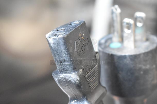 Close-up of a power plug labeled "ENCOR" for the 2021 Automatic Bar Controls JT-NITCOM-L Nitro Dispenser.