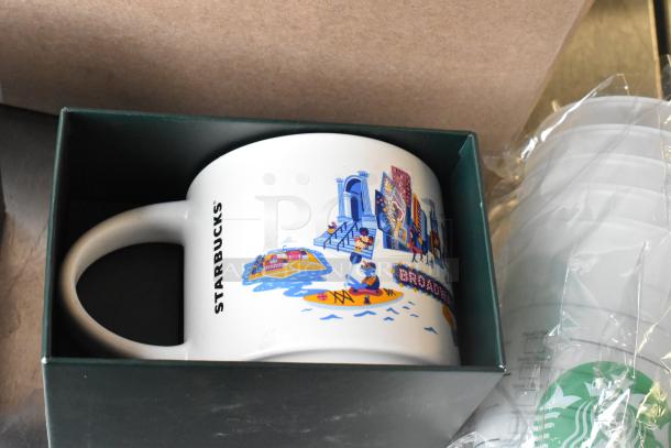 Starbucks ceramic mug in box with city scene design; includes poly cups, new condition.