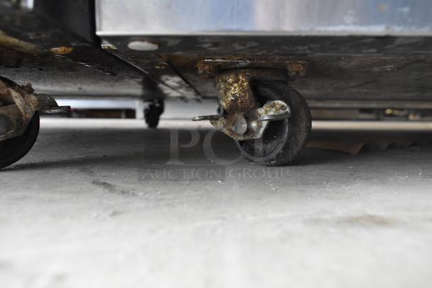 2019 Delfield 406P-STAR2 cooler on rusted commercial casters, showing wear. Stainless steel, 115V, 1-phase unit.