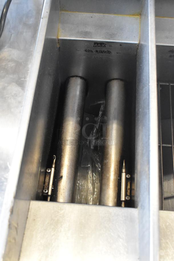 Pitco Frialator SG14T deep fat fryer with stainless steel finish, natural gas powered, 100,000 BTU, includes two fry baskets.