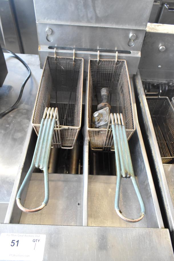 Pitco Frialator SG14T stainless steel deep fryer with two metal baskets, natural gas, 100,000 BTU, floor style.
