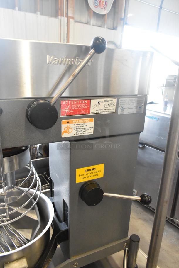 Varimixer W20 metal commercial 20-quart dough mixer with bowl, guard, whisk, pastry attachments; caution labels visible.