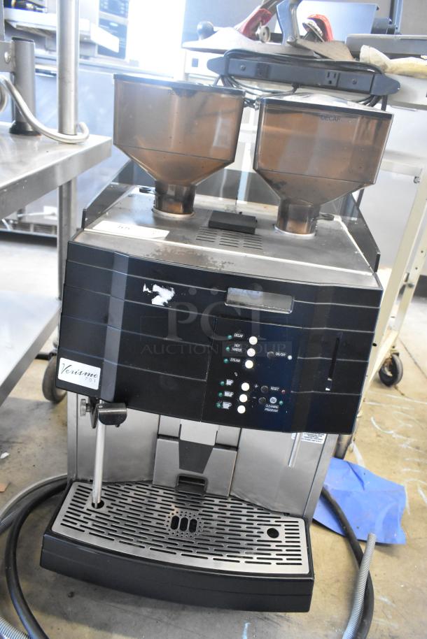 Schaerer Verismo 701 commercial espresso machine with dual hoppers, visible control panel, used condition. 208-240V, 1 phase.