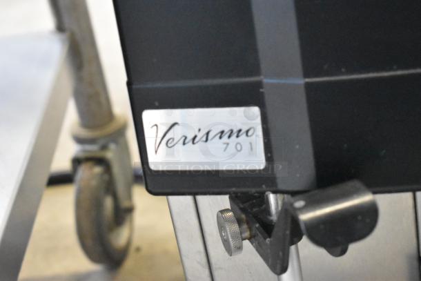 Schaerer Verismo 701 metal commercial countertop automatic espresso machine, 2 hoppers, label visible, 208-240V.