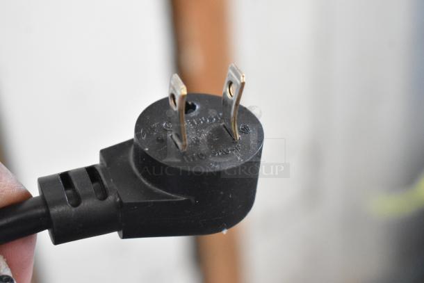 Power plug of a 2021 Delfield 406P-STAR2 stainless steel cooler. Black plug, 115 volts, 1 phase.