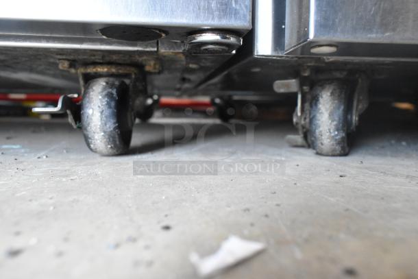 2021 Delfield 406P-STAR2 stainless steel undercounter cooler with commercial casters, single door, 115V, 1 phase.