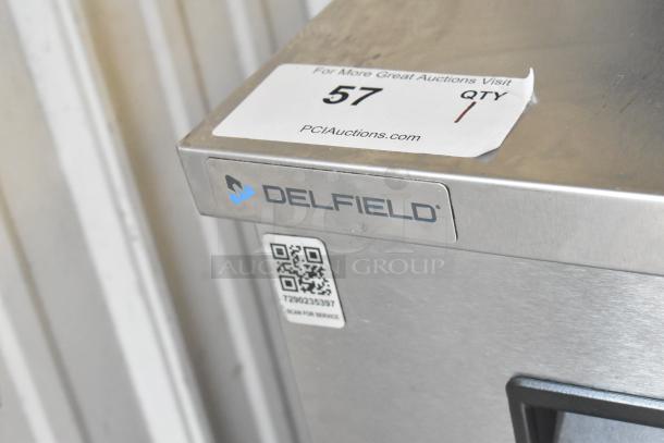 2021 Delfield 406P-STAR2 stainless steel undercounter cooler with casters, 115V, single phase. Features Delfield logo.