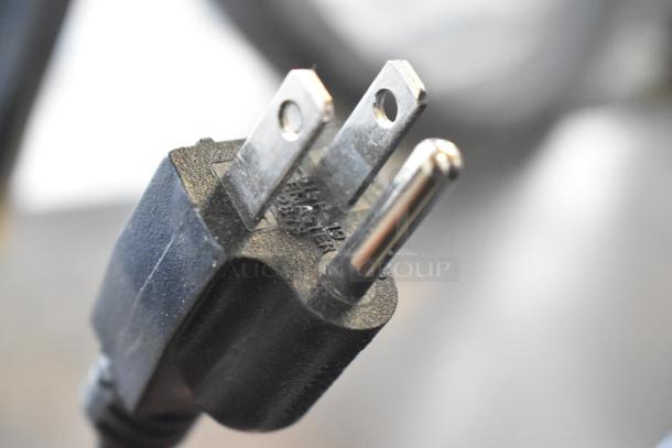 High-voltage black plug for a 2019 Bunn G2 HD Commercial Coffee Grinder, showing prongs and embossed text.