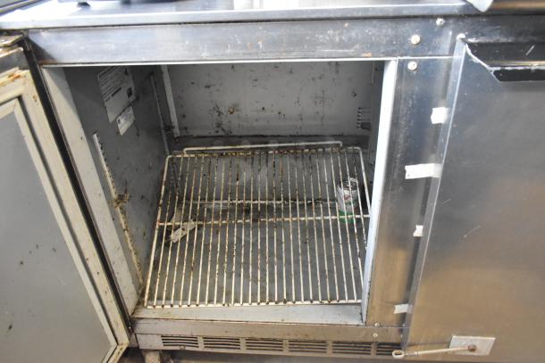 Beverage Air UCR72AY-23 stainless steel 3 door undercounter cooler on casters. Interior shows wear, commercial use. Model label inside.