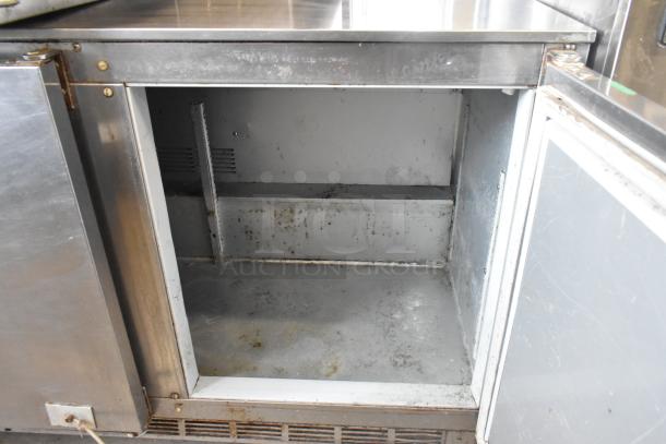 Beverage Air UCR72AY-23 stainless steel undercounter cooler with three doors, on commercial casters. 115V, 1 Phase. Used condition.