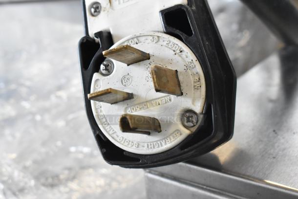Close-up of a 50A, 250V power plug for a Turbochef HhC2020 rapid cook oven. NEMA 15-60P, 3-phase.