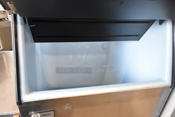 2021 Ice-O-Matic B55PSC stainless steel ice storage bin, 510 lb capacity, open lid, clean interior, minor exterior wear.