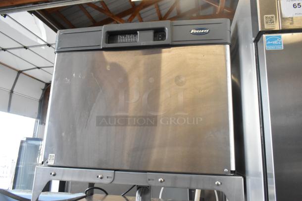 Follett B55H22H30 stainless steel ice head on Ice-O-Matic B55PSC bin. Commercial use, durable, slight surface marks.