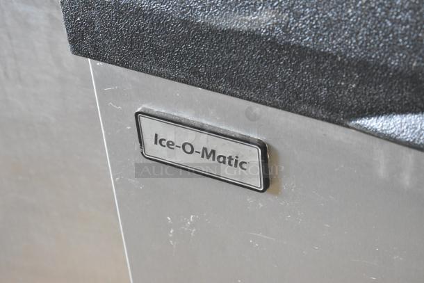 Follett B55H22H30 ice head on Ice-O-Matic B55PSC stainless ice bin. Stainless steel, commercial use, visible Ice-O-Matic label.