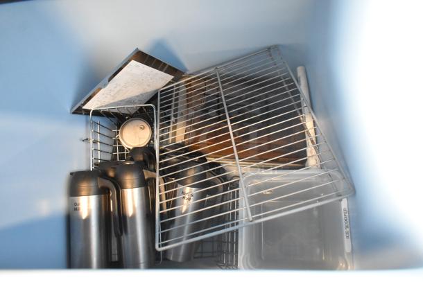 Follett B55H22H30 stainless steel commercial ice head on Ice-O-Matic B55PSC bin, good condition, wire shelving visible.