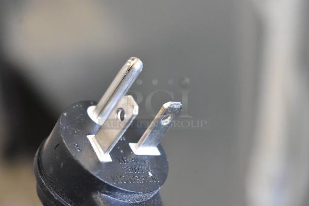 Stainless steel plug for Follett B55H22H30 ice maker and Ice-O-Matic B55PSC ice bin, showing electrical prongs and markings.