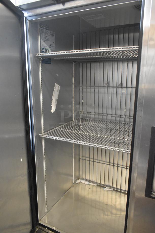 2019 True T-49F-HC stainless steel 2-door commercial freezer with poly coated racks, on casters. 115 volts, 1 phase.
