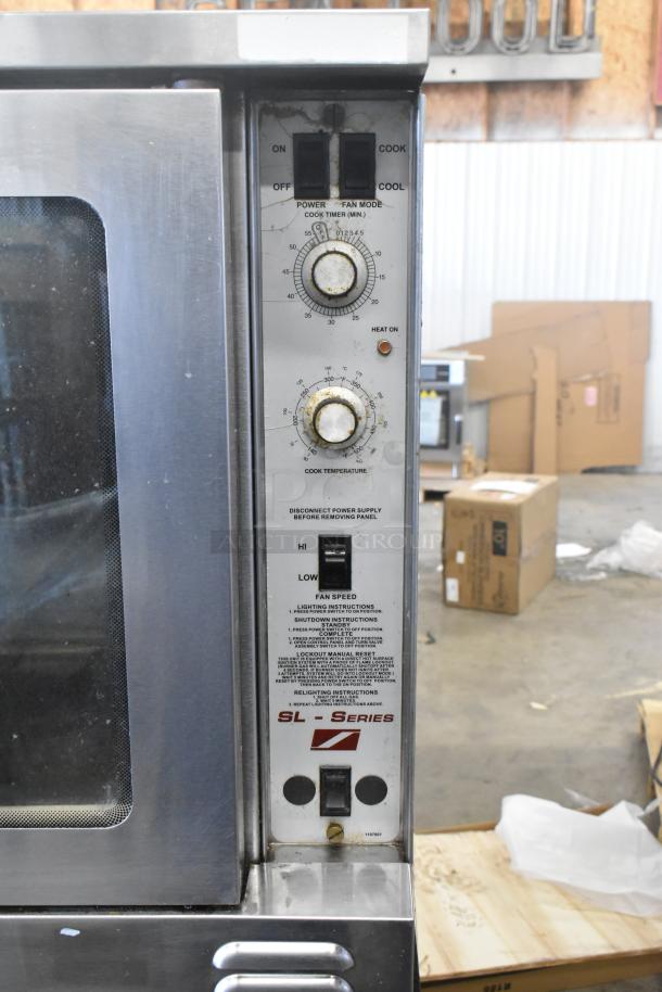 Southbend SL Series stainless steel convection oven with view-through doors, thermostatic controls, on commercial casters.