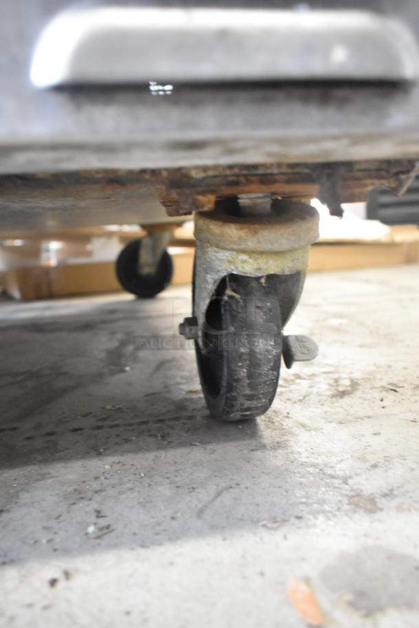 Southbend SL Series convection oven with view-through doors, thermostatic controls, and sturdy commercial casters.