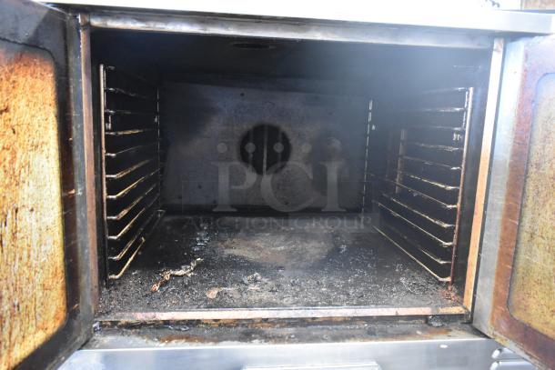 Southbend SL Series stainless steel commercial convection oven with view-through doors, thermostatic controls, on casters.