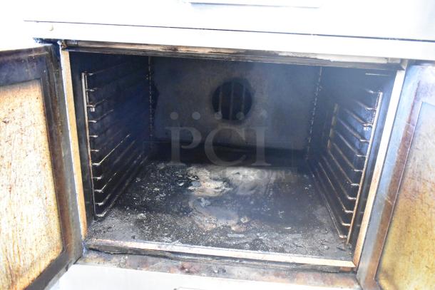 Southbend SL Series stainless steel commercial convection oven with view-through doors; shows interior racks and signs of use.