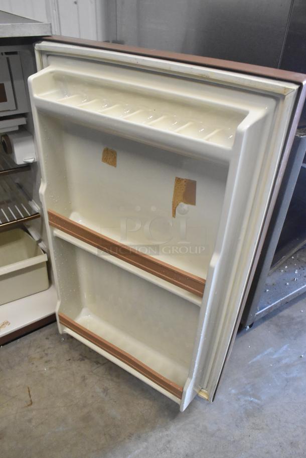 Danby Mini Cooler, 115 volts, 1 phase, cream interior with door storage. Used condition, some wear visible.