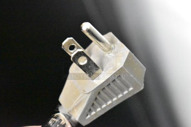 Close-up of a 3-prong plug for a Danby Mini Cooler, 115 volts, 1 phase.