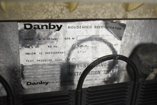 Danby Mini Cooler label showing model D742wal, 115V, 60Hz, Freon 12 refrigerant. Includes manufacturer details.