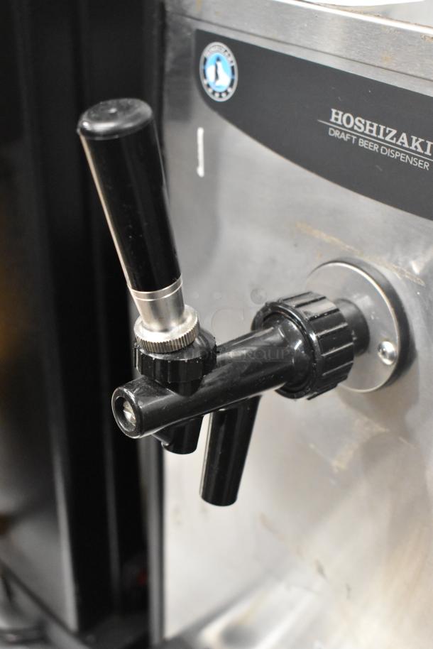 Hoshizaki DBF-40SAC stainless steel kegerator, showing tap handle. Model label reads "Draft Beer Dispenser." Good condition.