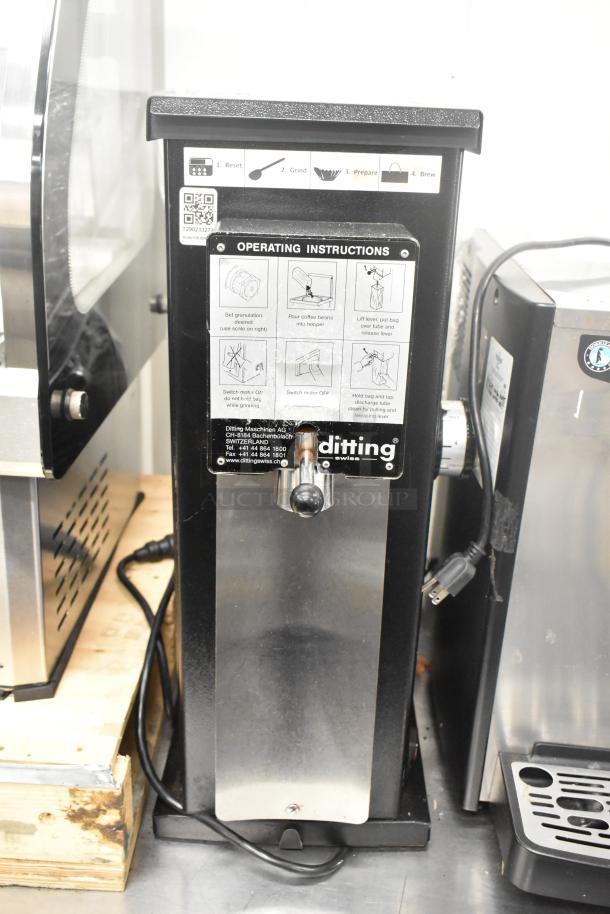 2017 Ditting KR1203 metal commercial countertop coffee bean grinder, 120V, 1 phase. Features operating instructions panel.