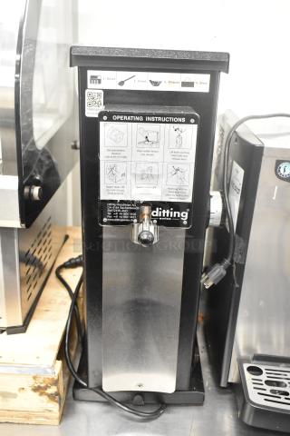 2017 Ditting KR1203 metal commercial countertop coffee bean grinder, 120V, 1 phase. Features operating instructions panel.