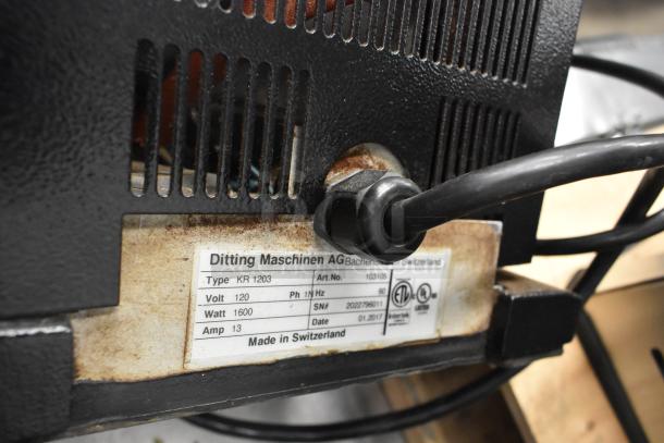 2017 Ditting KR1203 commercial coffee grinder, black metal, 120V, 1 phase. Label shows specifications and serial number. Made in Switzerland.