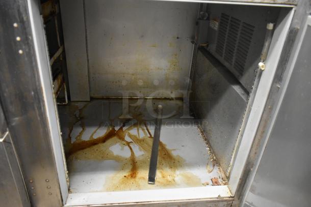 Beverage Air UCRD93A-4-23 stainless steel undercounter cooler interior, showing wear and stains, 115V, 1 phase.