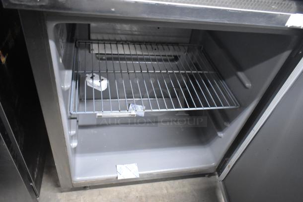 2019 Delfield 406P-STAR2 stainless steel undercounter cooler with single door, commercial casters, and interior shelving.