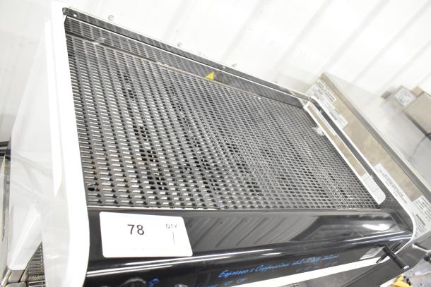 Faema Teorema stainless steel commercial espresso machine with 2 group heads, 3 portafilters, and 2 steam wands.