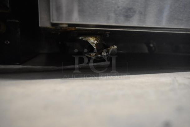 2020 Delfield 406P-STAR2 undercounter cooler caster with visible rust, part of stainless steel commercial cooler, 115V, 1 phase.