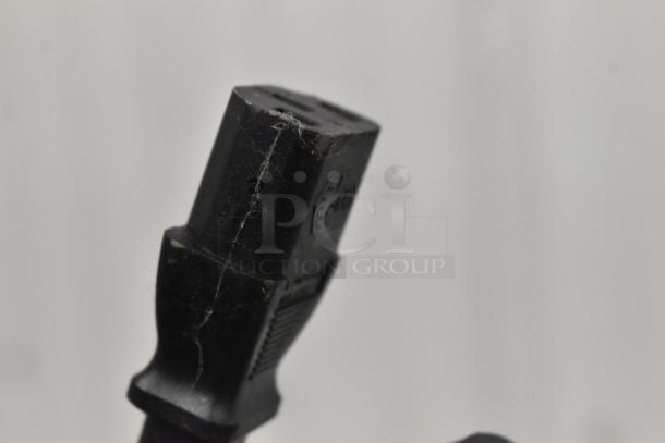 Close-up of a power cord for a 2023 Automatic Bar Controls JT-NITCOM-R Nitro Dispenser, showing minor wear.