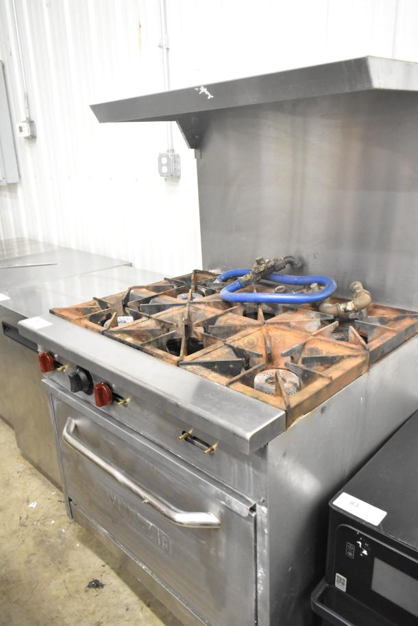 Vulcan SX36 commercial gas range, stainless steel, 6 burners, oven, over shelf, back splash, 198,000 BTU, used condition.