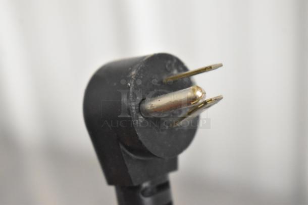 Close-up of a plug for the 2019 Delfield 406P-STAR2 undercounter cooler, showing three-pronged electrical connection.