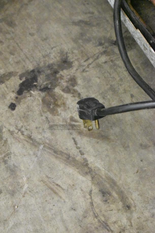 Electrical plug for Delfield 406P-STAR2 cooler, 115 volts, 1 phase, stainless steel, on commercial casters.