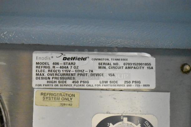 Delfield 406P-STAR2 stainless steel cooler label showing specifications: 115V, 1-phase, 15A circuit, R-404A refrigerant.