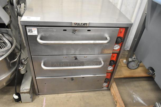 Vulcan stainless steel commercial warming drawer with three drawers, control knobs, and brand label. Good condition.