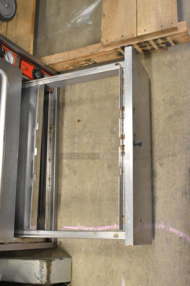 Vulcan stainless steel commercial 3-drawer warming drawer, visible wear, includes control panel with knobs. Suitable for professional kitchens.