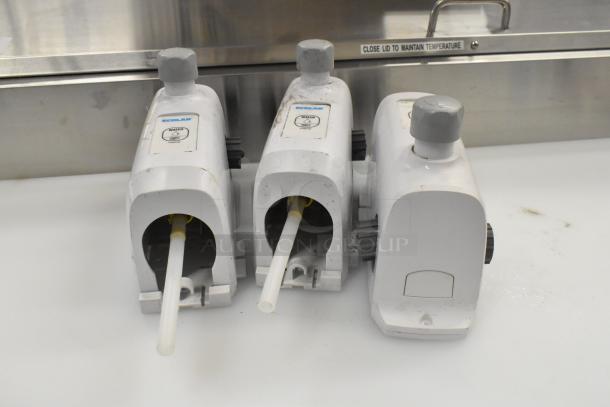 Three Ecolab LDS-AIR GAP dispensers, white, used condition, visible water labels and control knobs.