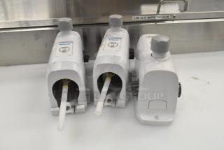 Three Ecolab LDS-AIR GAP dispensers, white, used condition, visible water labels and control knobs.